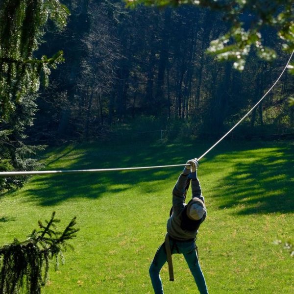 a person standing on a lush green field