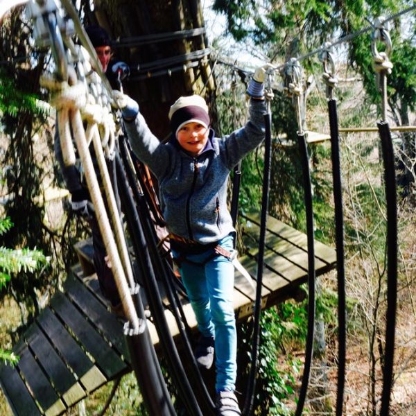 a person standing next to a tree