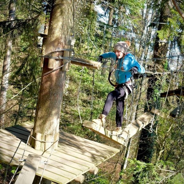 a man standing next to a tree
