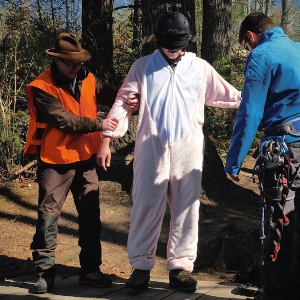 a group of people standing around each other