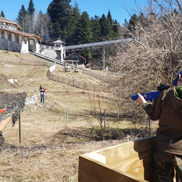 a little boy that is standing in the dirt
