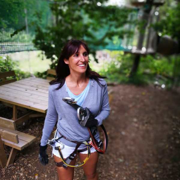 a young girl sitting on a bench