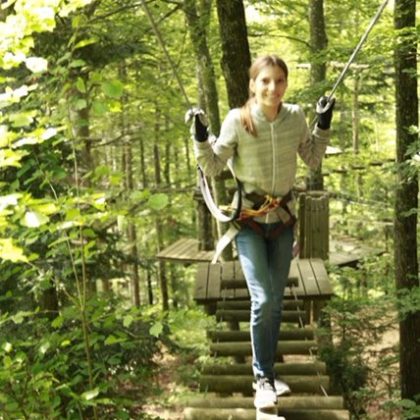 a statue of a person in a forest