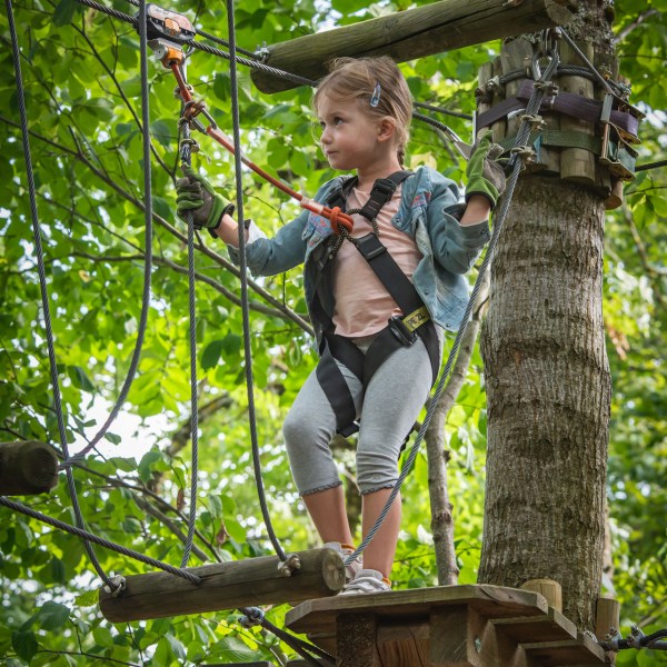 a young girl holding a pole